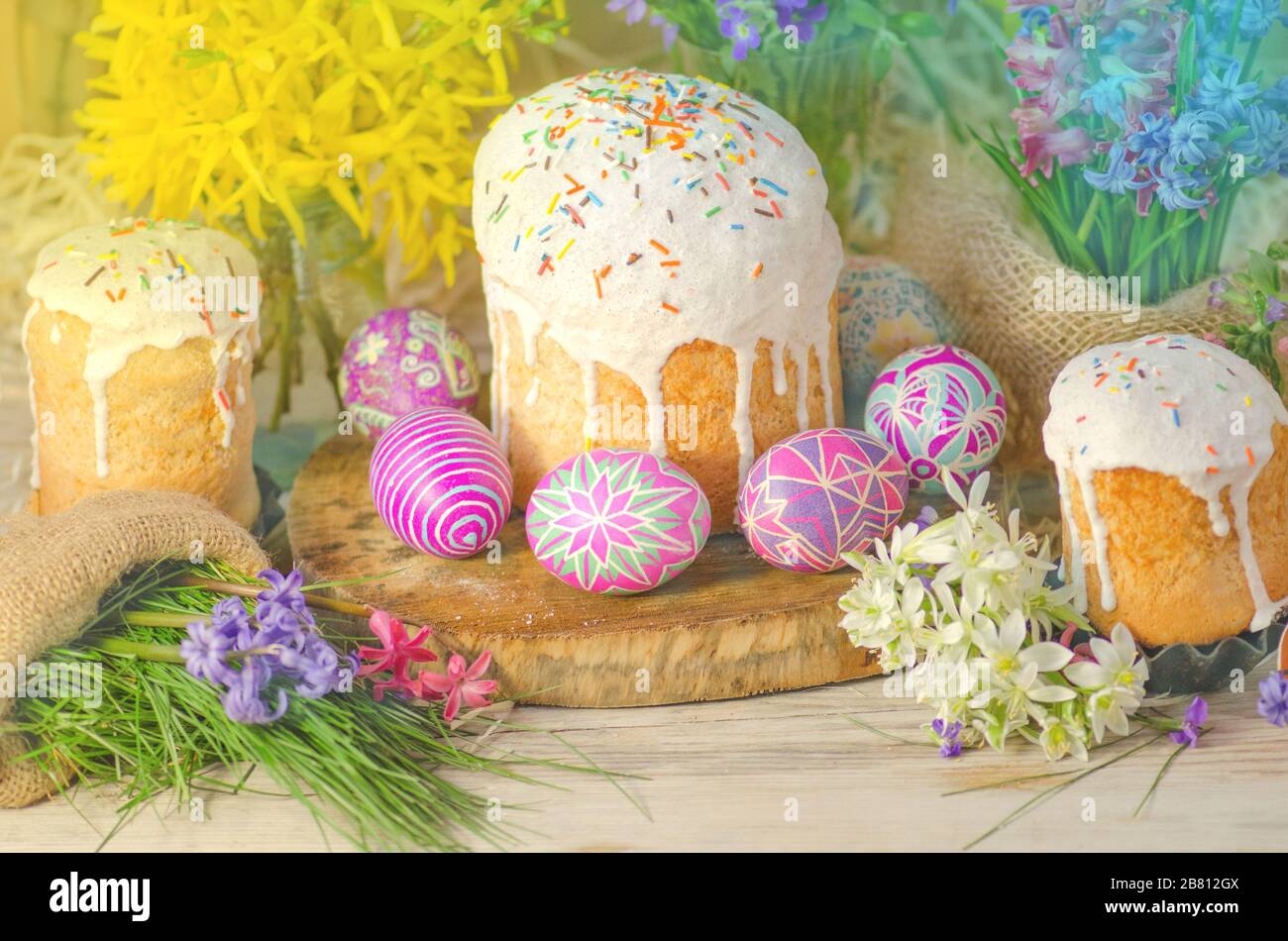 Pastel Easter egg. Pastel colored decorated easter eggs and Easter cake. Pastel colored Easter holiday background. Stock Photo