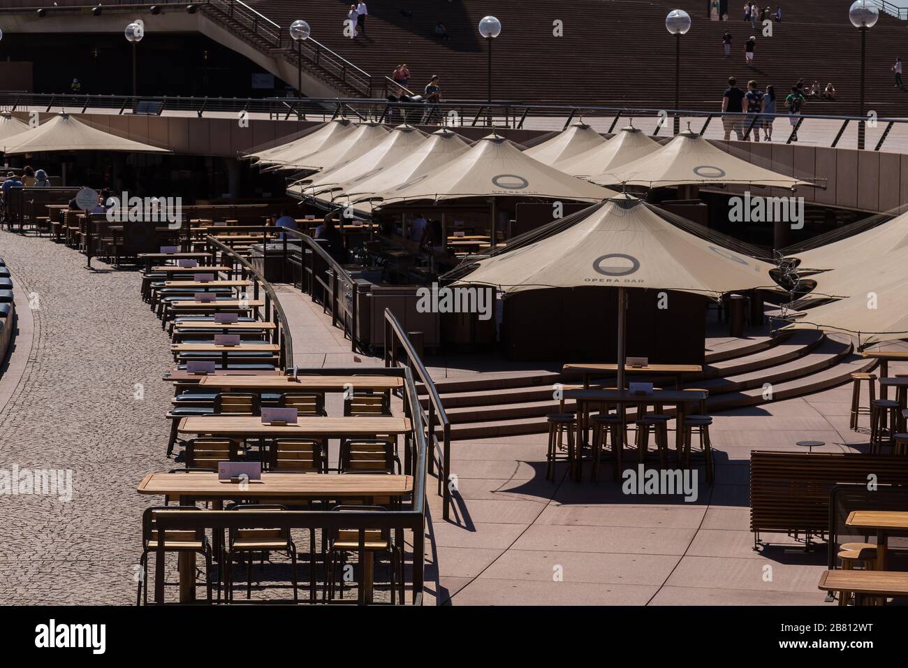 Opera Bar, Circular Quay, in Sydney's Central Business District is very empty as a result of the Coronavirus Outbreak, with very few customers aroun Stock Photo