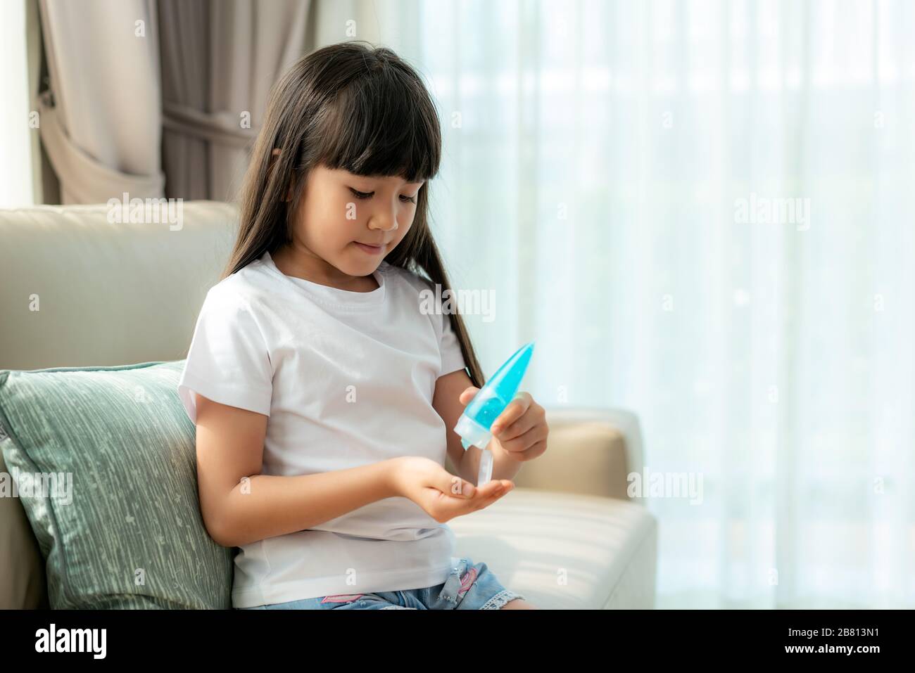 Children applying hand lotion hires stock photography and images Alamy