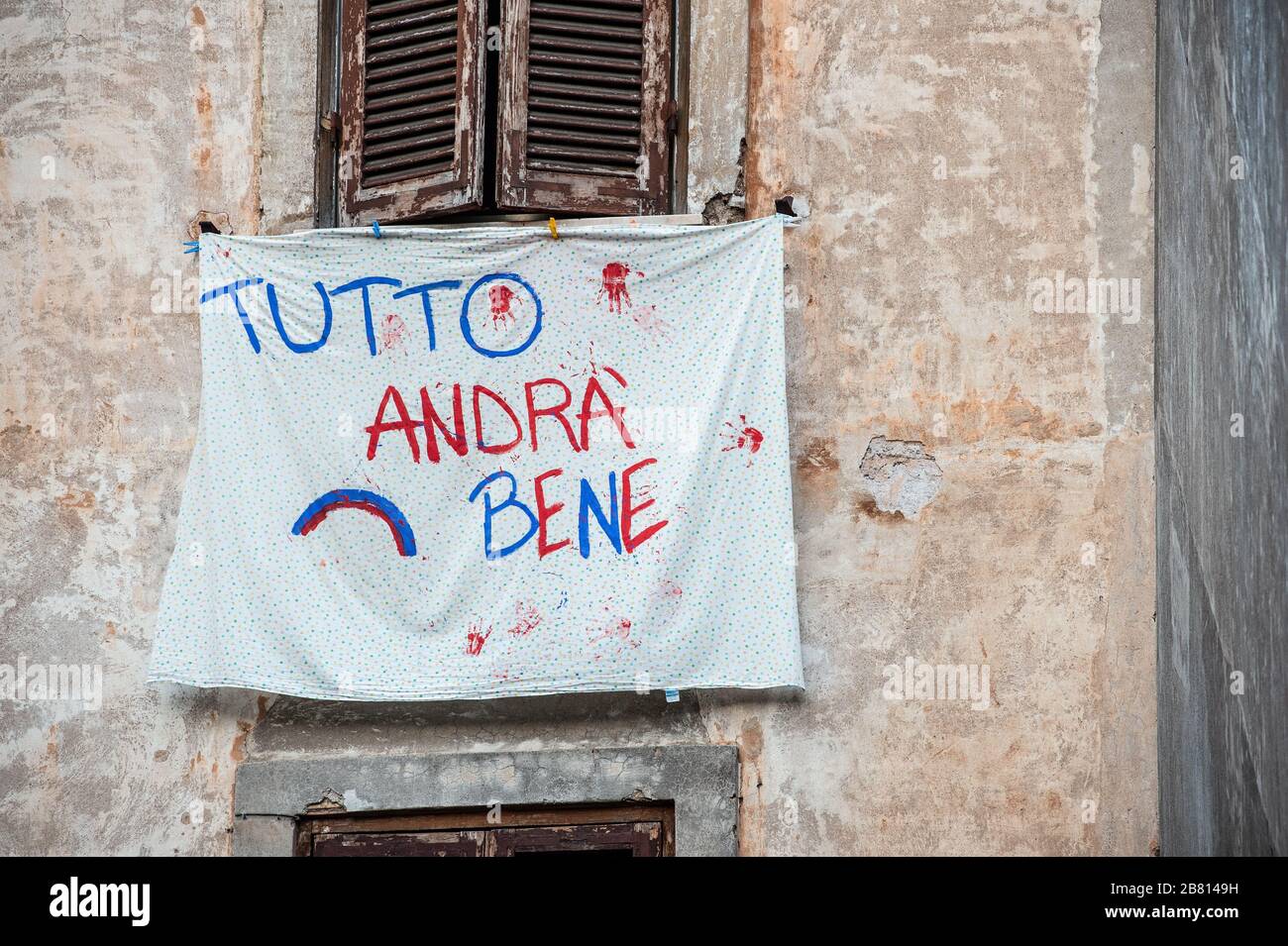 Solidarity banners have appeared on many windows and balconies of houses in the popular Garbatella district in Rome, Italy, in the fight against the Coronavirus epidemic that has hit the country heavily. The phrase most often cited in these banners is 'Tutto andrà bene - Everything will be fine'. Stock Photo