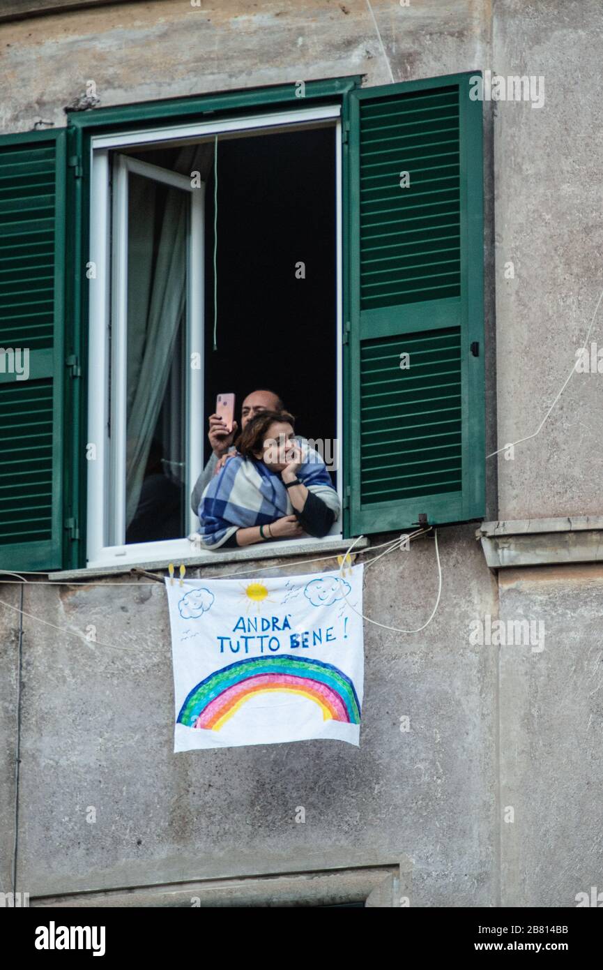 Solidarity banners have appeared on many windows and balconies of houses in the popular Garbatella district in Rome, Italy, in the fight against the Coronavirus epidemic that has hit the country heavily. The phrase most often cited in these banners is 'Tutto andrà bene - Everything will be fine'. Stock Photo