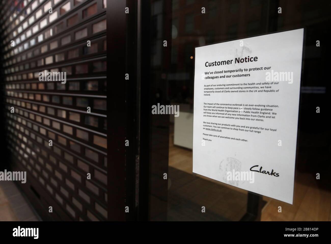 A sign in the window of a Clarks store on Market Street in Manchester  notifying customers of their closure due to Coronavirus, as NHS England  announced that the coronavirus death toll had