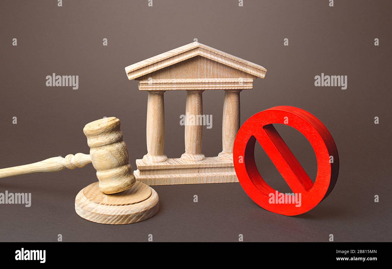 Courthouse and red prohibition sign NO. Implementation of laws restrictions and prohibition. Fines and penalties for rules violations. Unpopular laws, Stock Photo