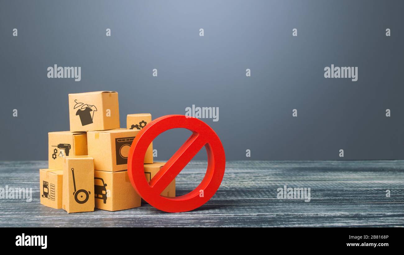 Cardboard boxes and red prohibition symbol NO. Import restriction, ban export of dual-use goods to countries under sanctions. Out of stock. Embargo tr Stock Photo