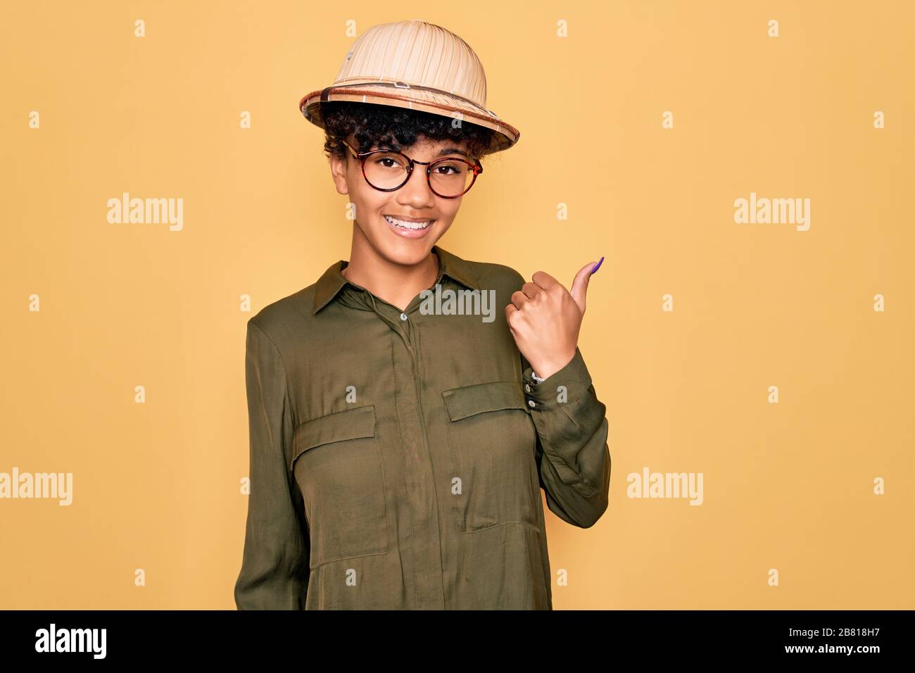 Young beautiful african american tourist woman wearing glasses and ...