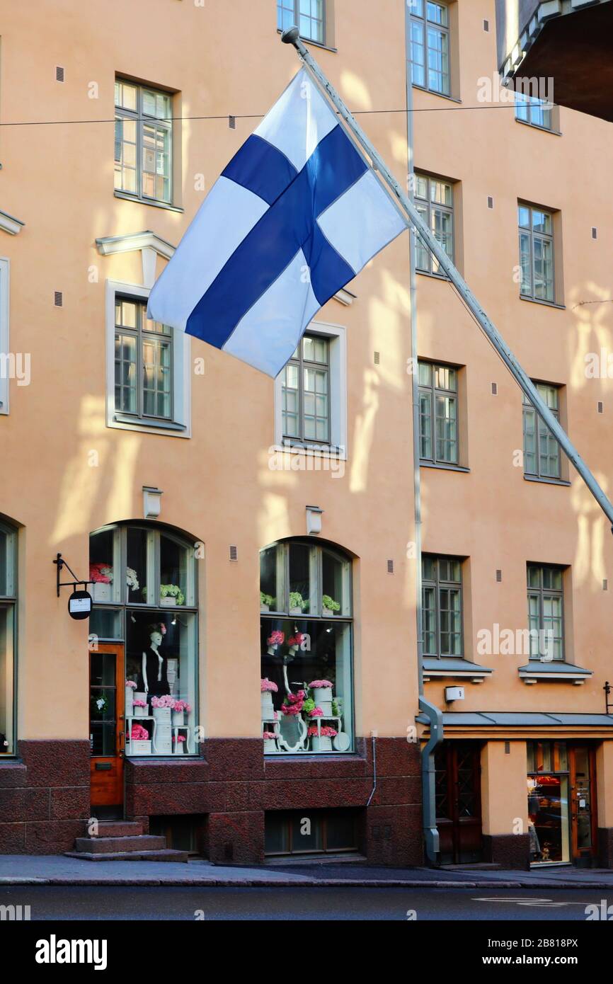 Helsinki, Finland. March 19, 2020. Flag of Finland on Minna Canth Day over empty street under Coronavirus pandemic. Stock Photo