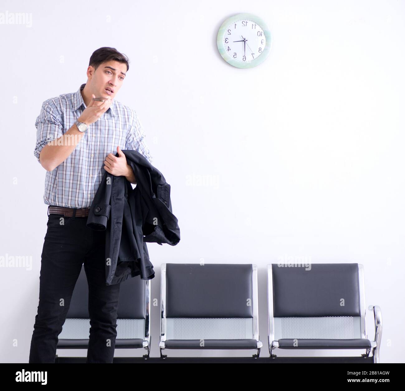 The man nervously impatiently waiting in the lobby Stock Photo - Alamy
