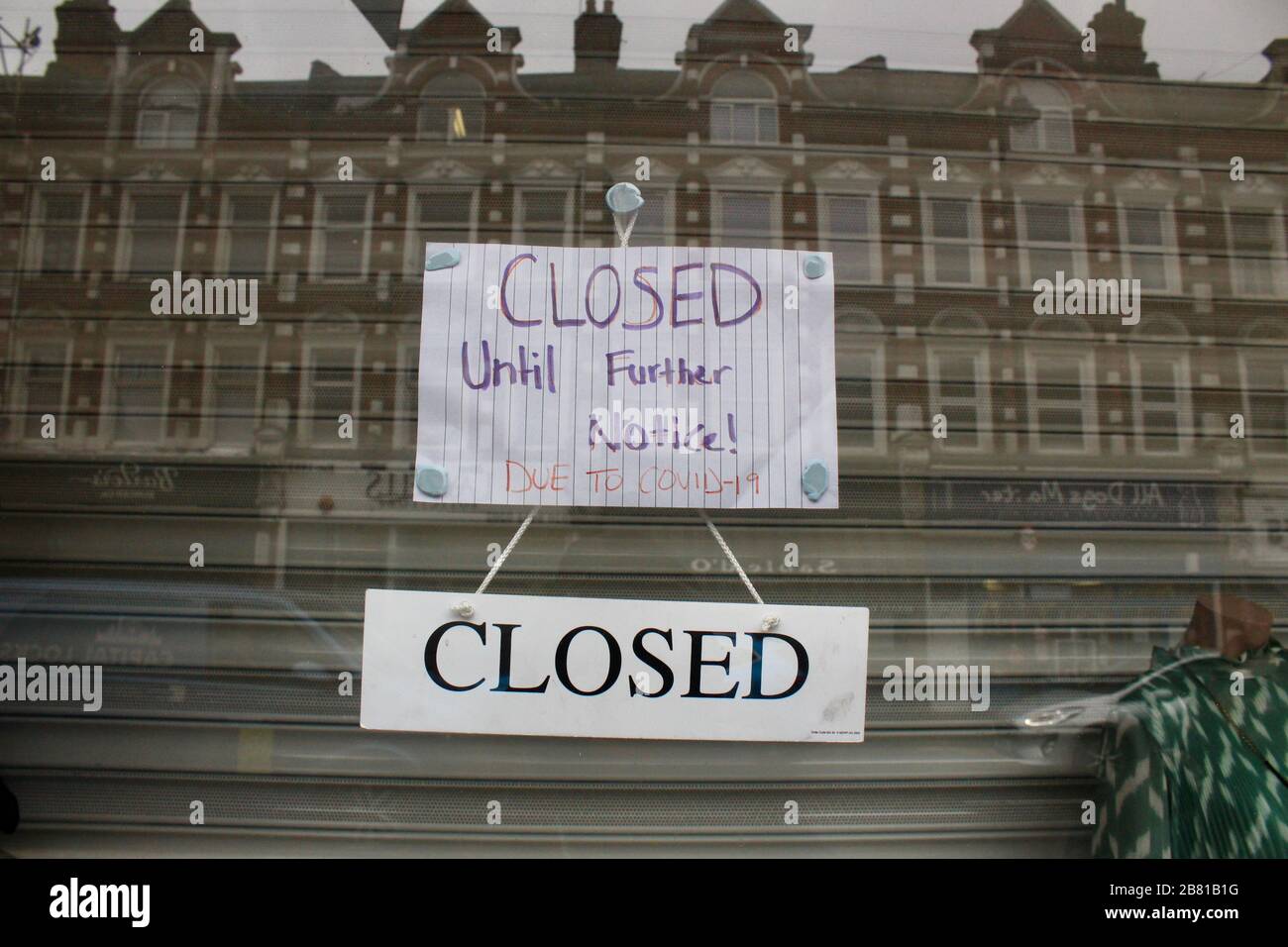 a sign in a shop in muswell hill london warns of closure during covid 19 outbreak pandemic UK Stock Photo