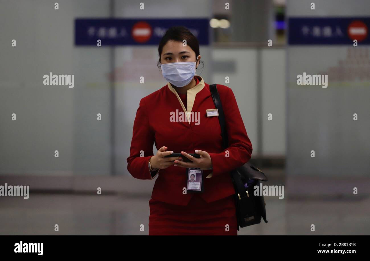 Hong Kong, CHINA. 19th Mar, 2020. Masked Cathay Pacific Airways flight attendant exit from restricted area at the arriving hall, Hong Kong International Airport.Mar-19, 2020 Hong Kong.ZUMA/Liau Chung-ren Credit: Liau Chung-ren/ZUMA Wire/Alamy Live News Stock Photo