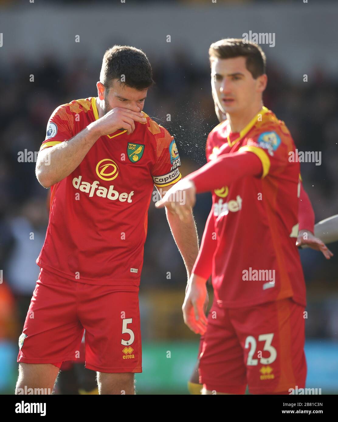 Norwich City's Grant Hanley blows his nose during the Premier League match at Molineux, Wolverhampton. Stock Photo