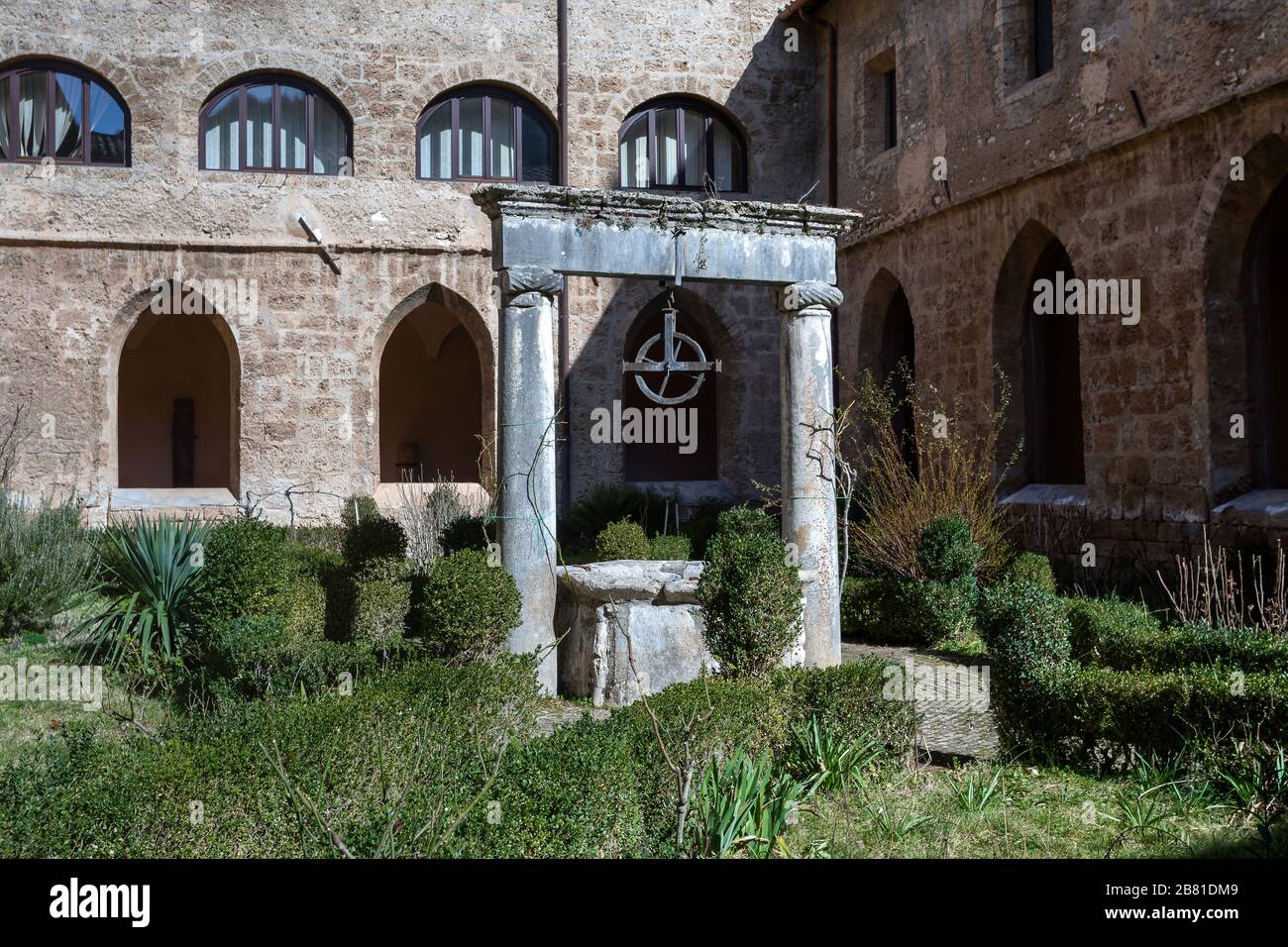 Subiaco, Italy - February 23, 2020: Monastery of Santa Scolastica - the ancient well from inside the cloister. Stock Photo