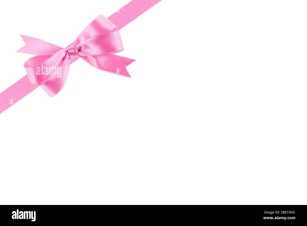 Pink ribbon with a bow on white background Stock Photo - Alamy