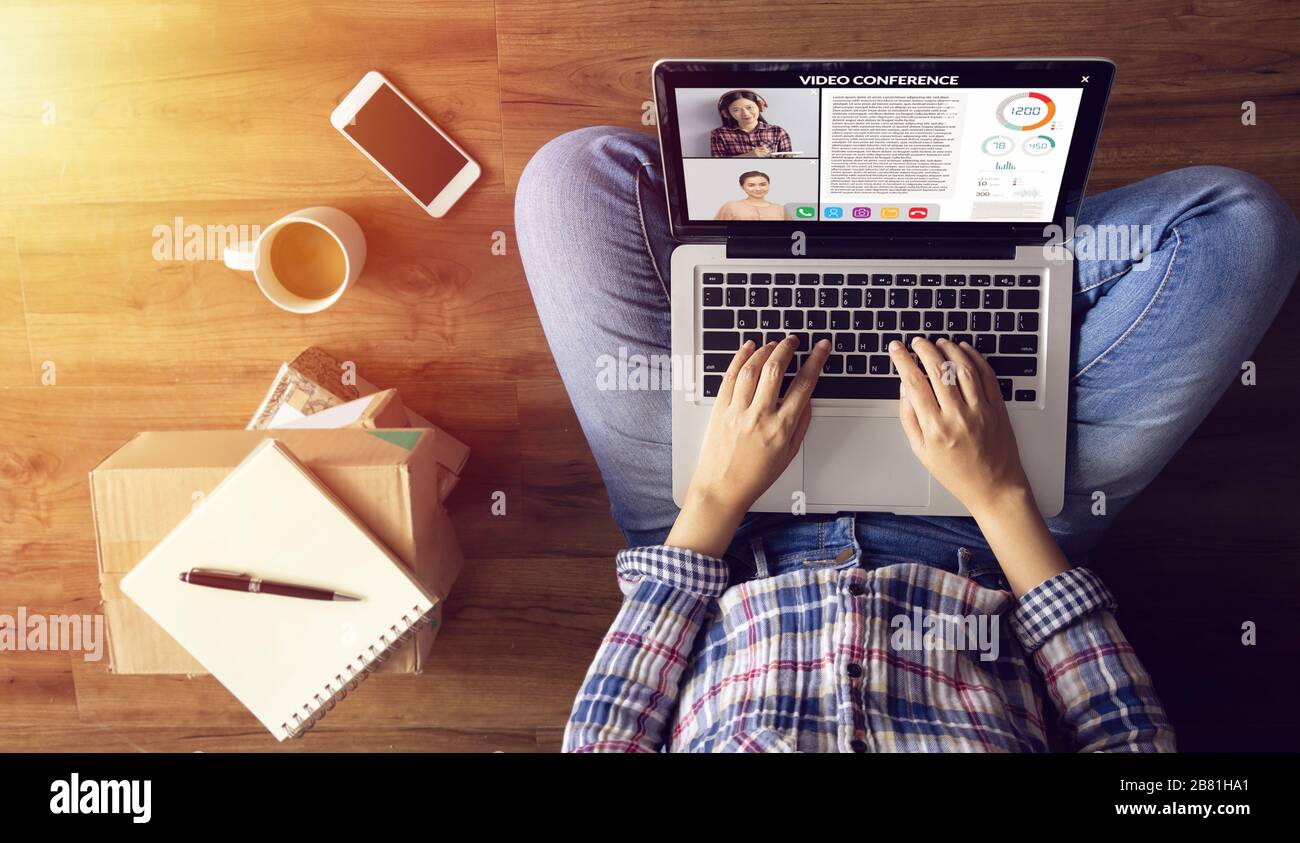 work from home. people making video conference with colleague via laptop computer during home quarantine to avoid spreading illness transmission of CO Stock Photo