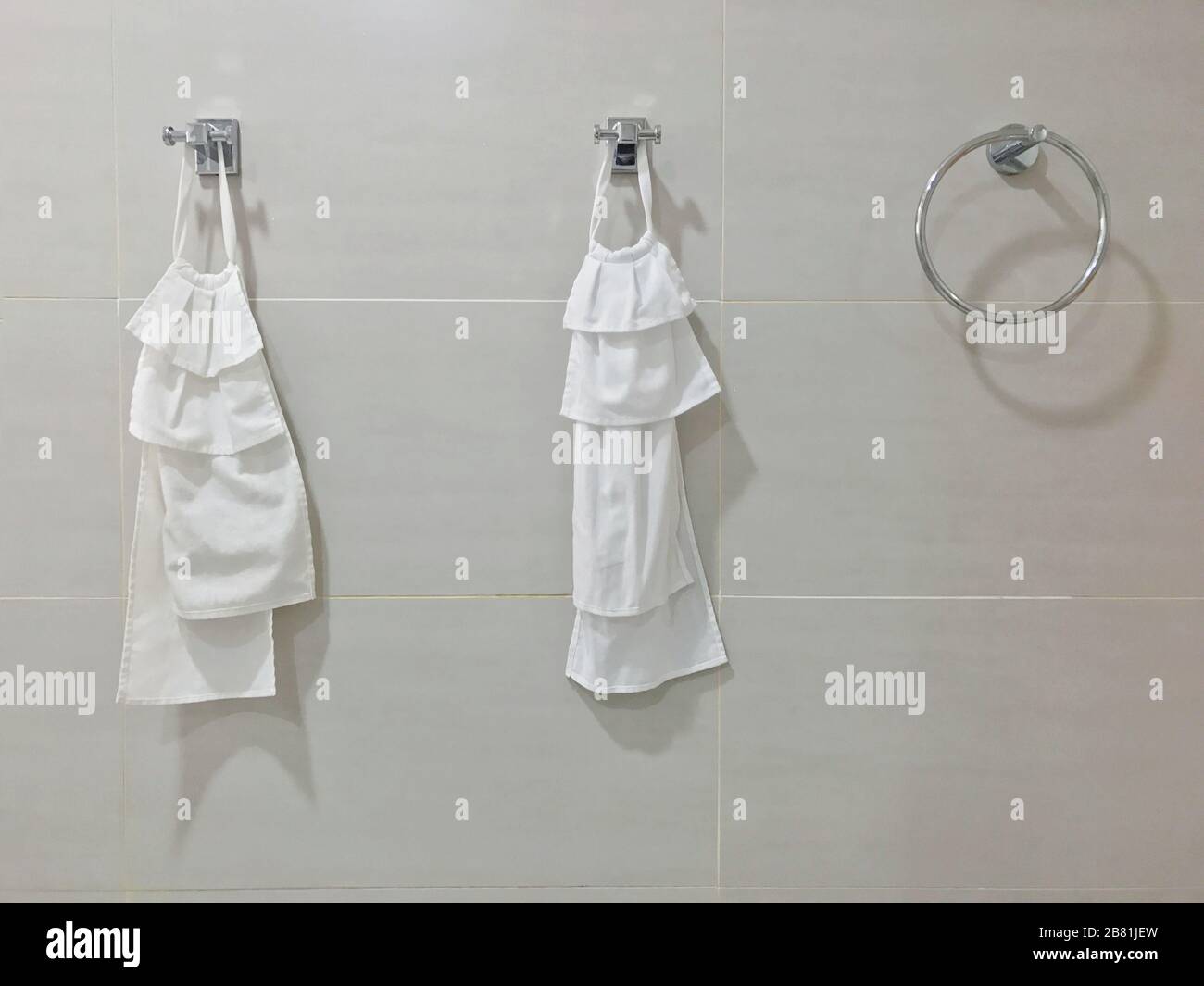 Towel rail Stainless white Hanging loop at Bathroom Wall modern, Cloth towels in the bathroom Stock Photo