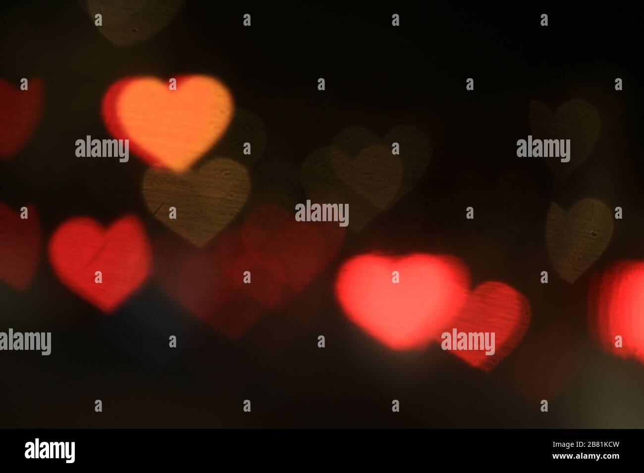 Valentines Colorful heart-shaped on black background lighting bokeh for  decoration at night backdrop wallpaper blurred valentine, Love Pictures  backgr Stock Photo - Alamy