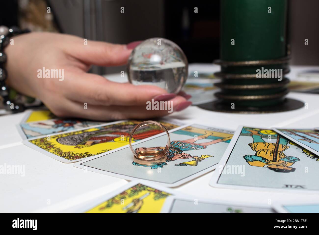 Bangkok, Thailand, March.15.20.Wedding rings are on Tarot cards. The Gypsy lays out Tarot cards and guesses for the future. Magic sessions with talkin Stock Photo