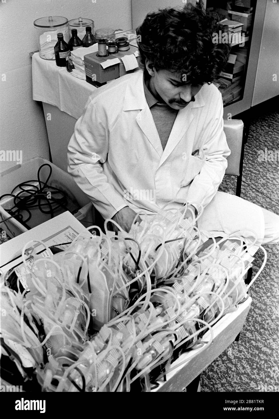 30 November 1984, Saxony, Eilenburg: Blood bags - A blood donation campaign of the Transfusion Service Leipzig takes place in the 1980s in the Eilenburg District Hospital. Exact admission date not known. Photo: Volkmar Heinz/dpa-Zentralbild/ZB Stock Photo