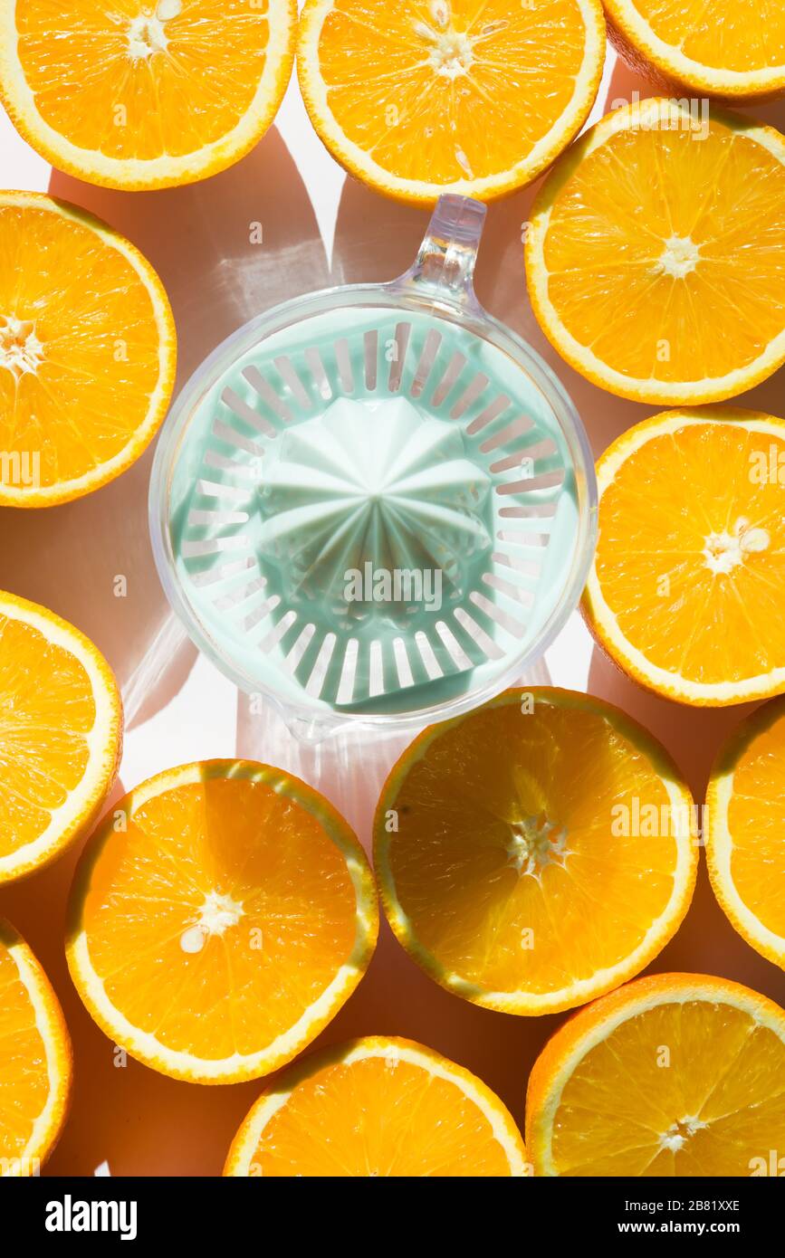 https://c8.alamy.com/comp/2B81XXE/orange-fruit-and-orange-squeezer-juice-vitamin-c-to-fight-the-coronavirus-top-view-image-2B81XXE.jpg