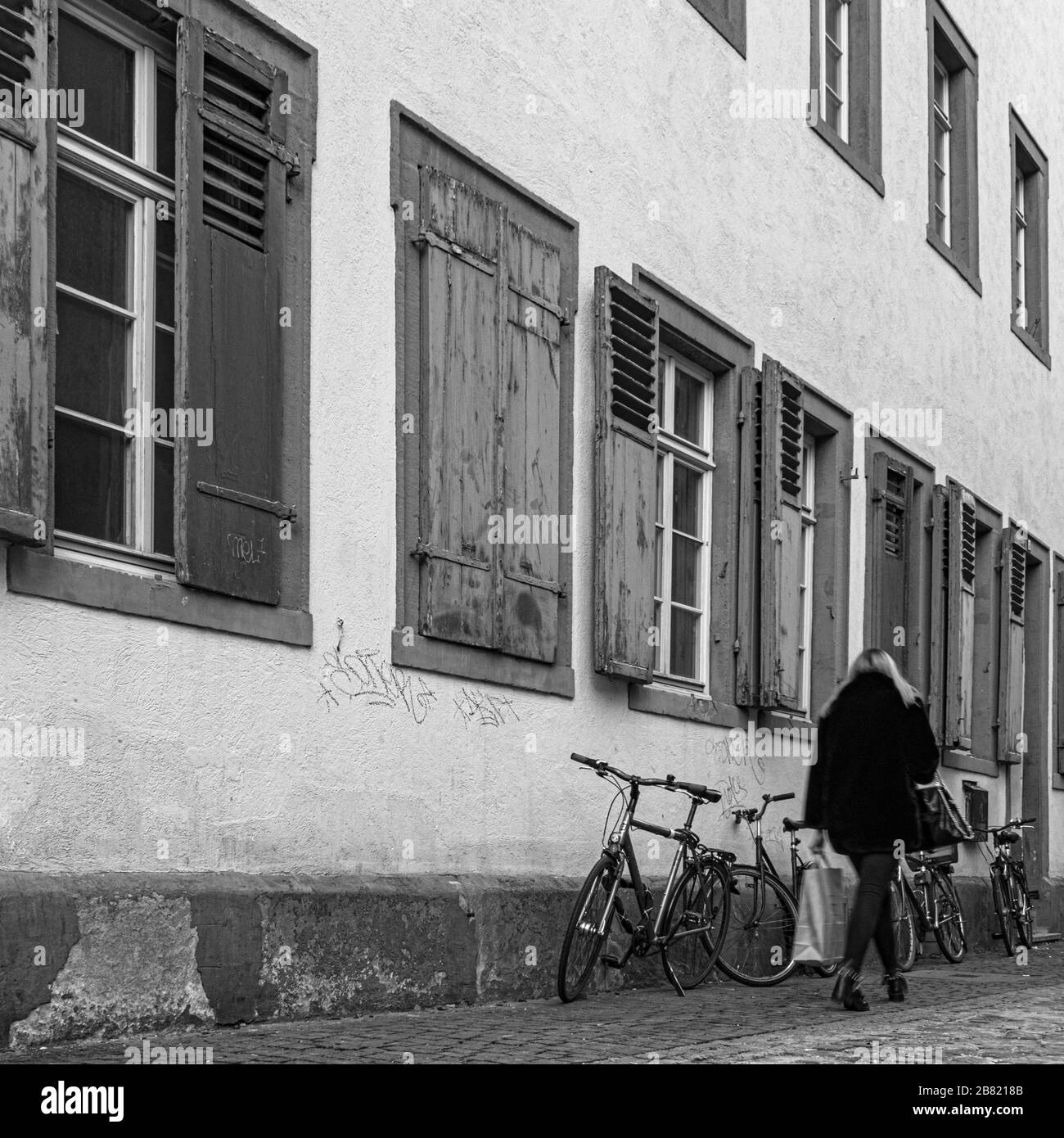 Woman walking old house Black and White Stock Photos & Images - Alamy