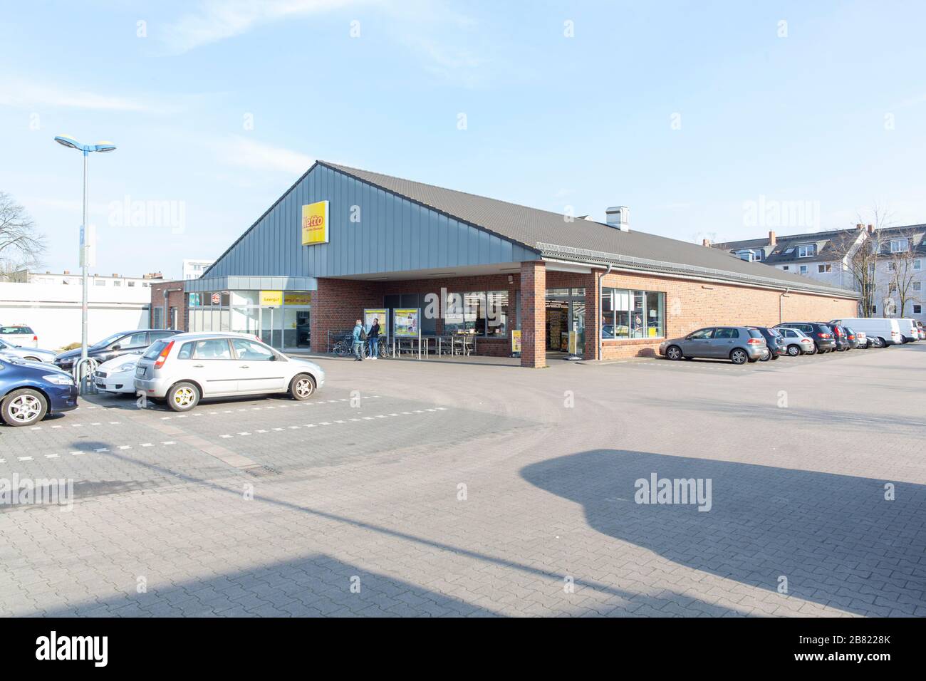 Hannover, Germany, 16.03.2020: Storefront of a Netto supermarket in Vahrenwald with daylight and blue sky. Stock Photo
