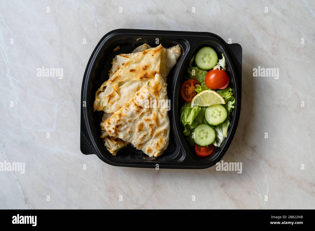 Turkish Take Away Food Gozleme Made with Flat Bread and Salad in Plastic  Container Box Plate. Traditional Fast Food Stock Photo - Alamy