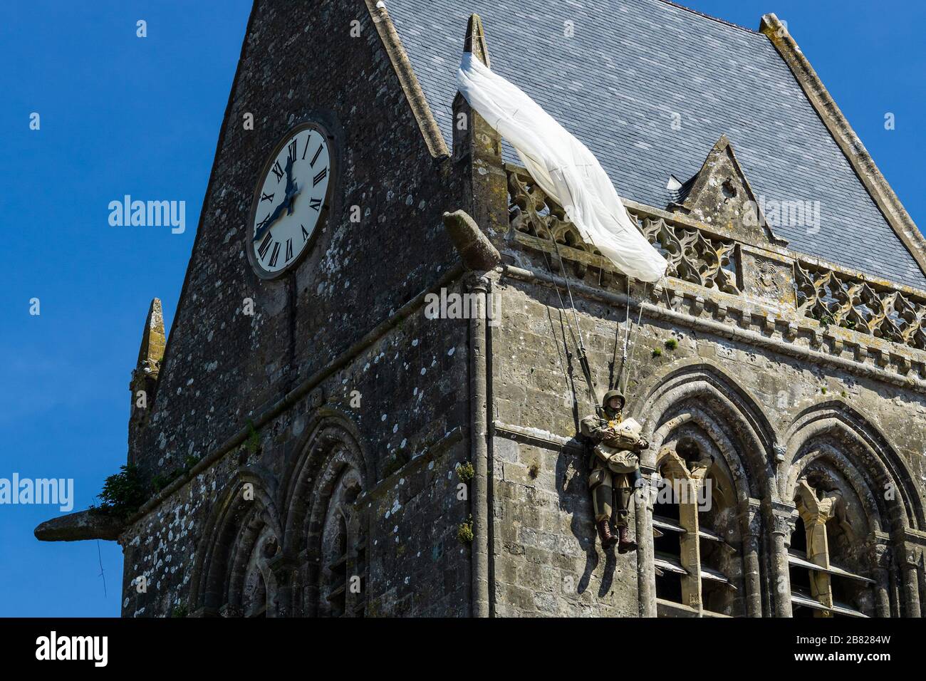 American John Steele paratrooper memorial hanging at the church rooftop