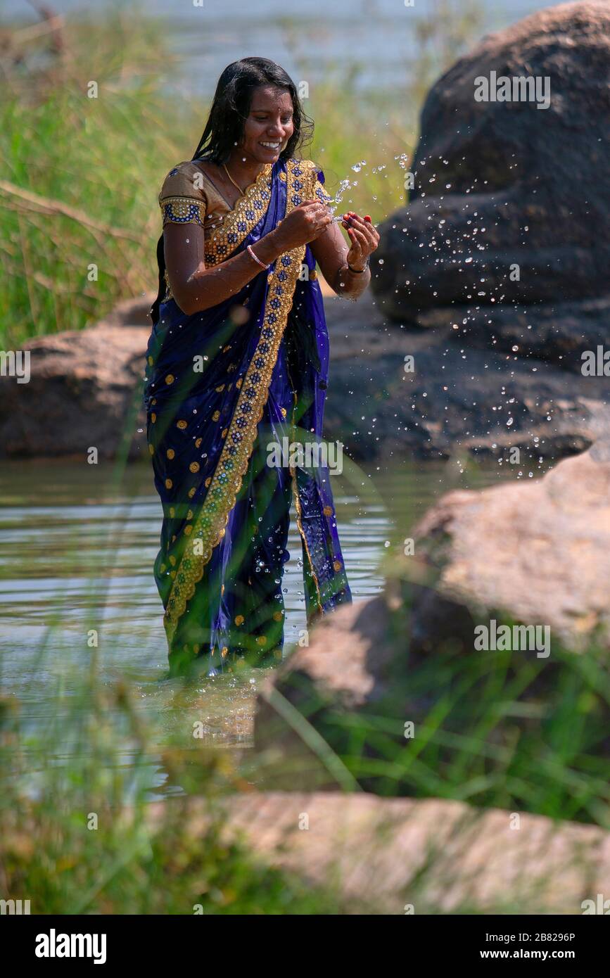 An Indian woman performs her ritual purifications in the Tungabhadra