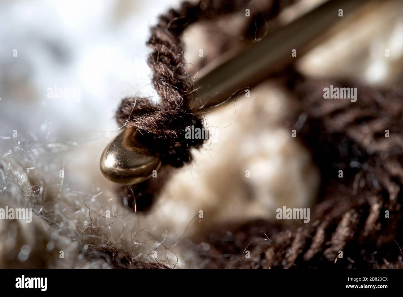Crochet hook in the work macro view Stock Photo