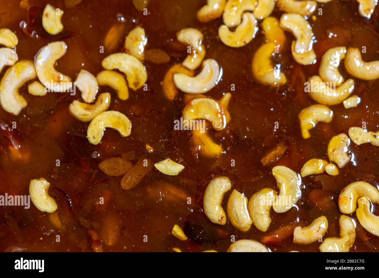 Chutney sauce made from mango, apples, raisins, dates and cashews. A popular Indian regional cuisine served after main course as a sweet dish. Bengali Stock Photo