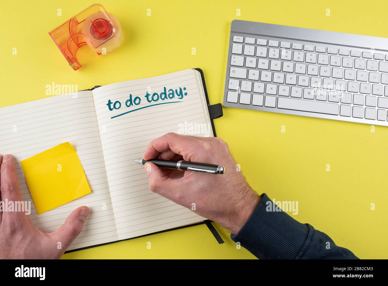 top view of person writing to-do list on notepad, time management and task management concept Stock Photo
