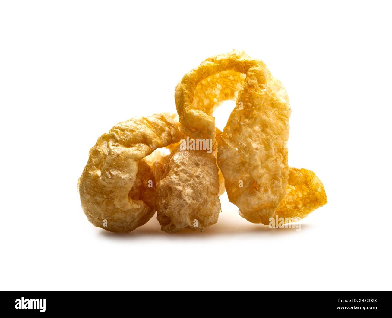 Pork snack crispy and blistered isolated on white background. Crispy pork skin pieces. Food concept. Stock Photo