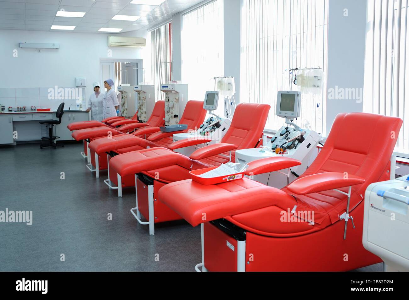 Separating apparatus and daybeds set at the City (municipal) blood transfusion station for taking blood from donors Stock Photo