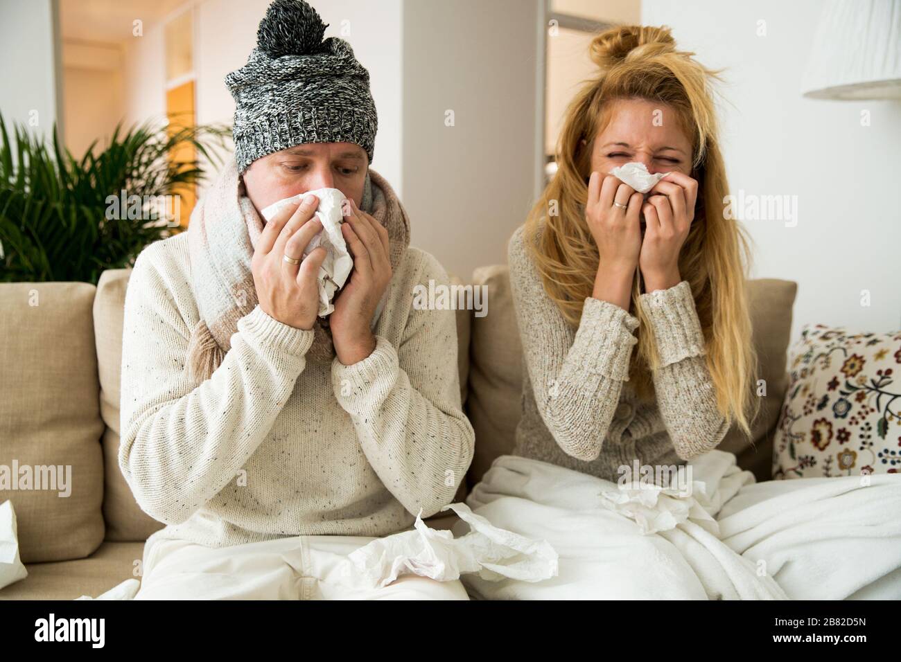 Sick couple catch cold. Man and woman sneezing, coughing. People got