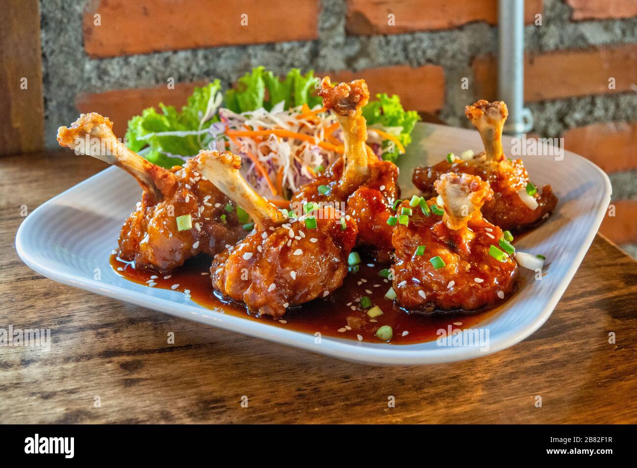Sweet and sour chicken legs Stock Photo