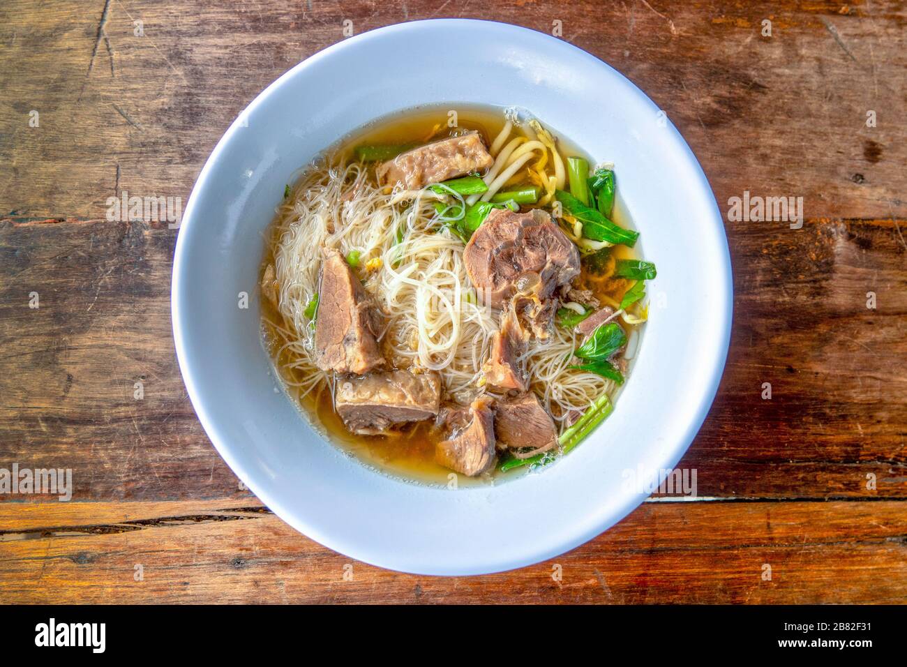 Noodle soup with stewed beef from above Stock Photo