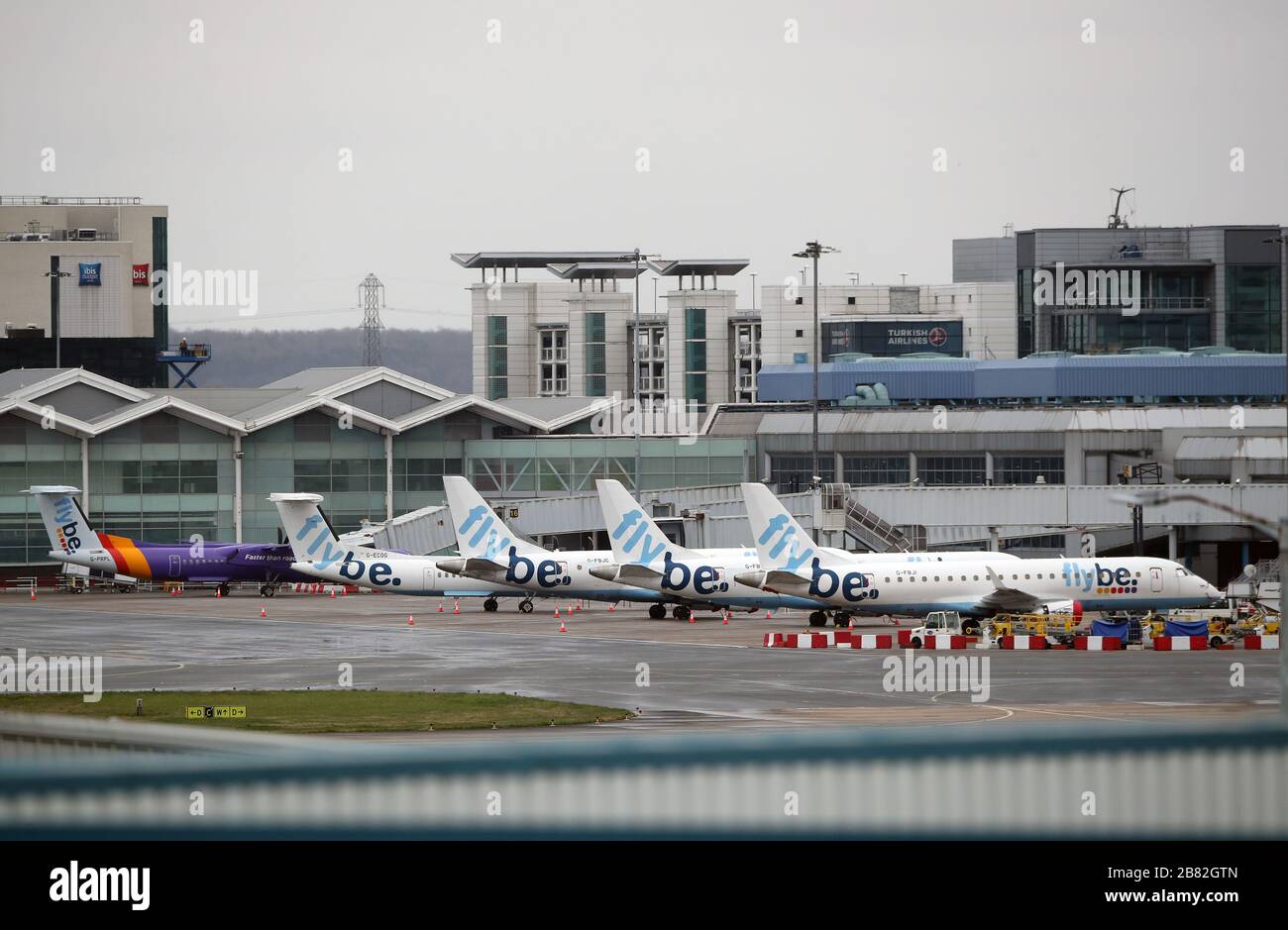 Flybe planes grounded as they recently went into administration seen at Birmingham Airport. Stock Photo