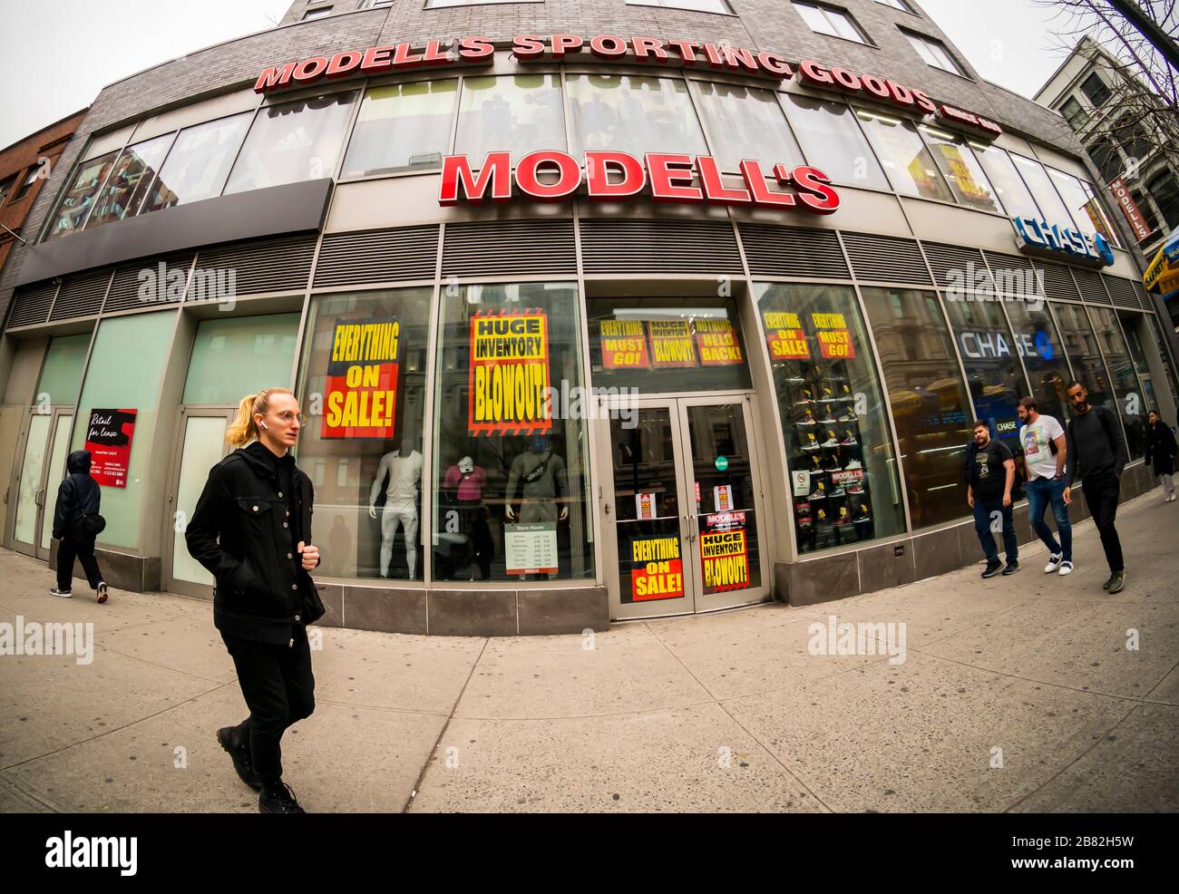 The Chelsea location of the family-owned sporting goods chain, Modell's, is plastered with signs announcing that the store is closing, seen in New York on Thursday, March 12, 2020. The 131 year old chain has filed for bankruptcy protection and is closing all of its 115 stores.(© Richard B. Levine) Stock Photo