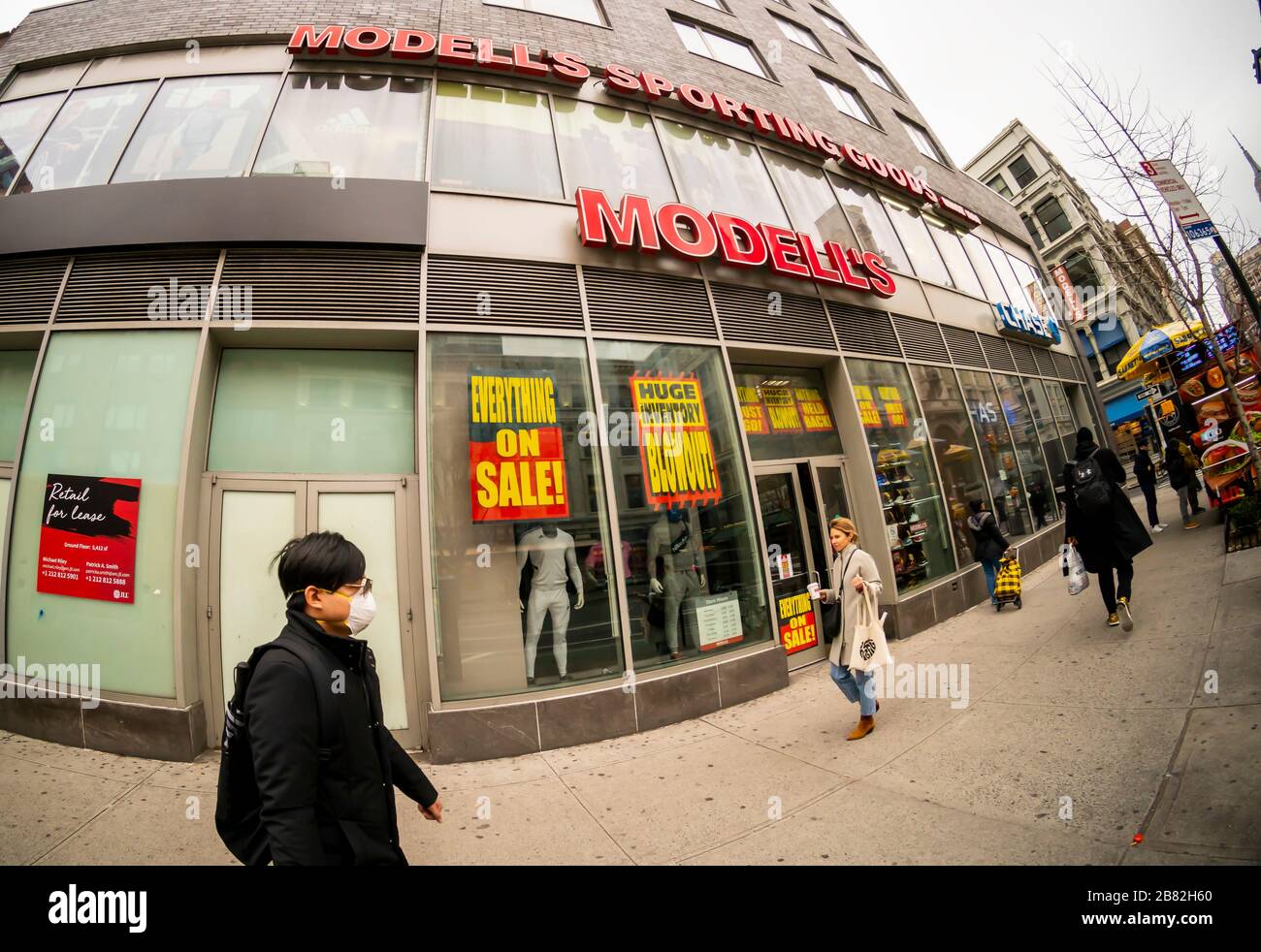 The Chelsea location of the family-owned sporting goods chain, Modell's, is plastered with signs announcing that the store is closing, seen in New York on Thursday, March 12, 2020. The 131 year old chain has filed for bankruptcy protection and is closing all of its 115 stores.(© Richard B. Levine) Stock Photo