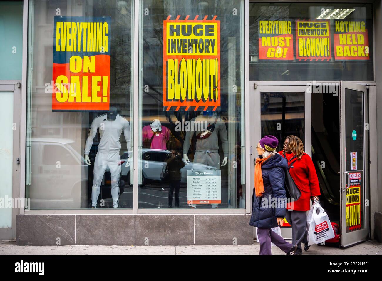 The Chelsea location of the family-owned sporting goods chain, Modell's, is plastered with signs announcing that the store is closing, seen in New York on Thursday, March 12, 2020. The 131 year old chain has filed for bankruptcy protection and is closing all of its 115 stores.(© Richard B. Levine) Stock Photo