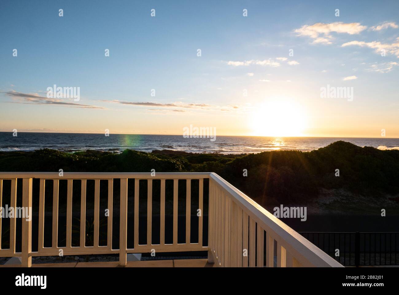 Balcony overlooking Beach at Sunset, Hermanus, Garden Route, South Africa Stock Photo
