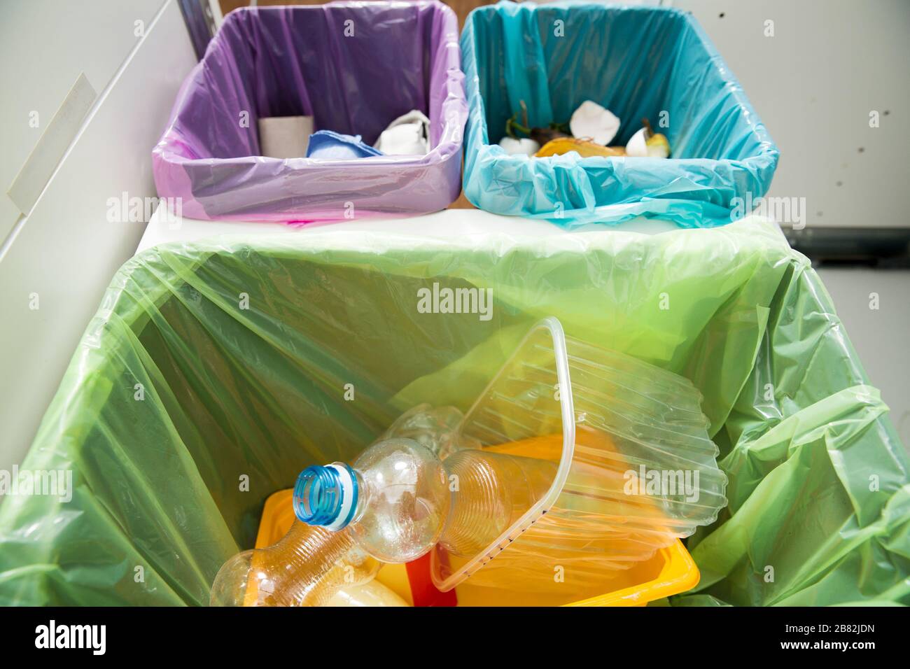Garbage cans flat top view. Three trash bins with sorted garbage in