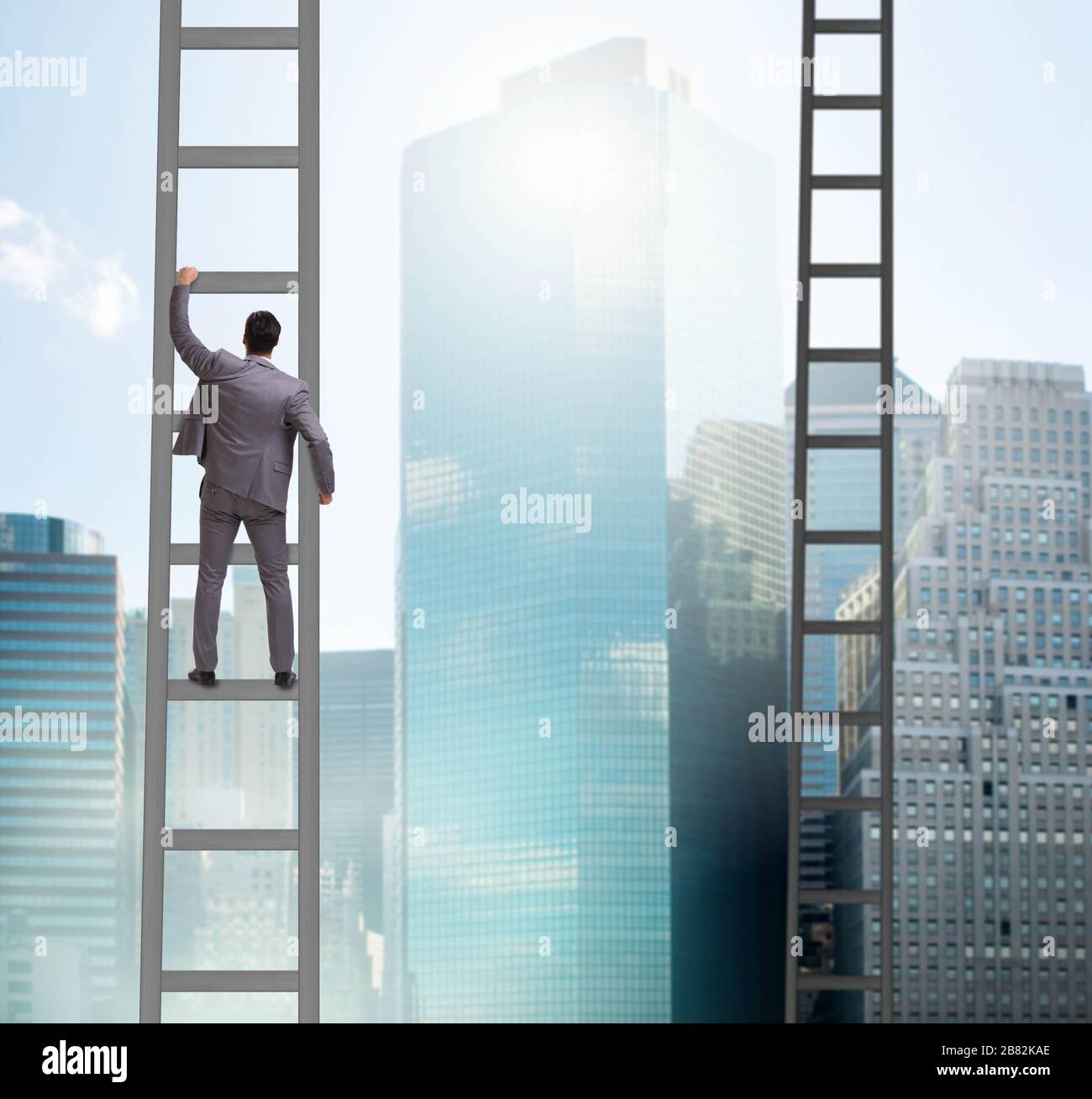 The young businessman climbing career ladder Stock Photo - Alamy