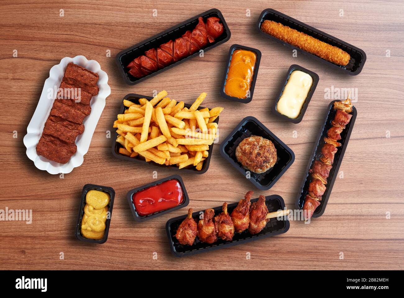 Composition of Fast food Snacks, sausage and french fries Stock Photo
