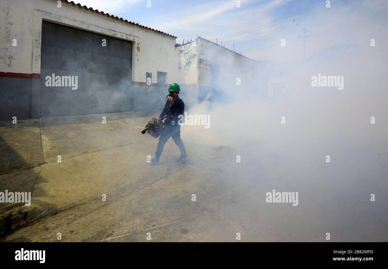 Valencia, Carabobo, Venezuela. 19th Mar, 2020. March 9, 2020, A worker performs fumigation work in residences in various sectors of the city, as a way to prevent other diseases that may arise during the Coronvirus outbreak (Covid-9). In Valencia, Carabobo state. Photo: Juan Carlos Hernandez. Credit: Juan Carlos Hernandez/ZUMA Wire/Alamy Live News Stock Photo