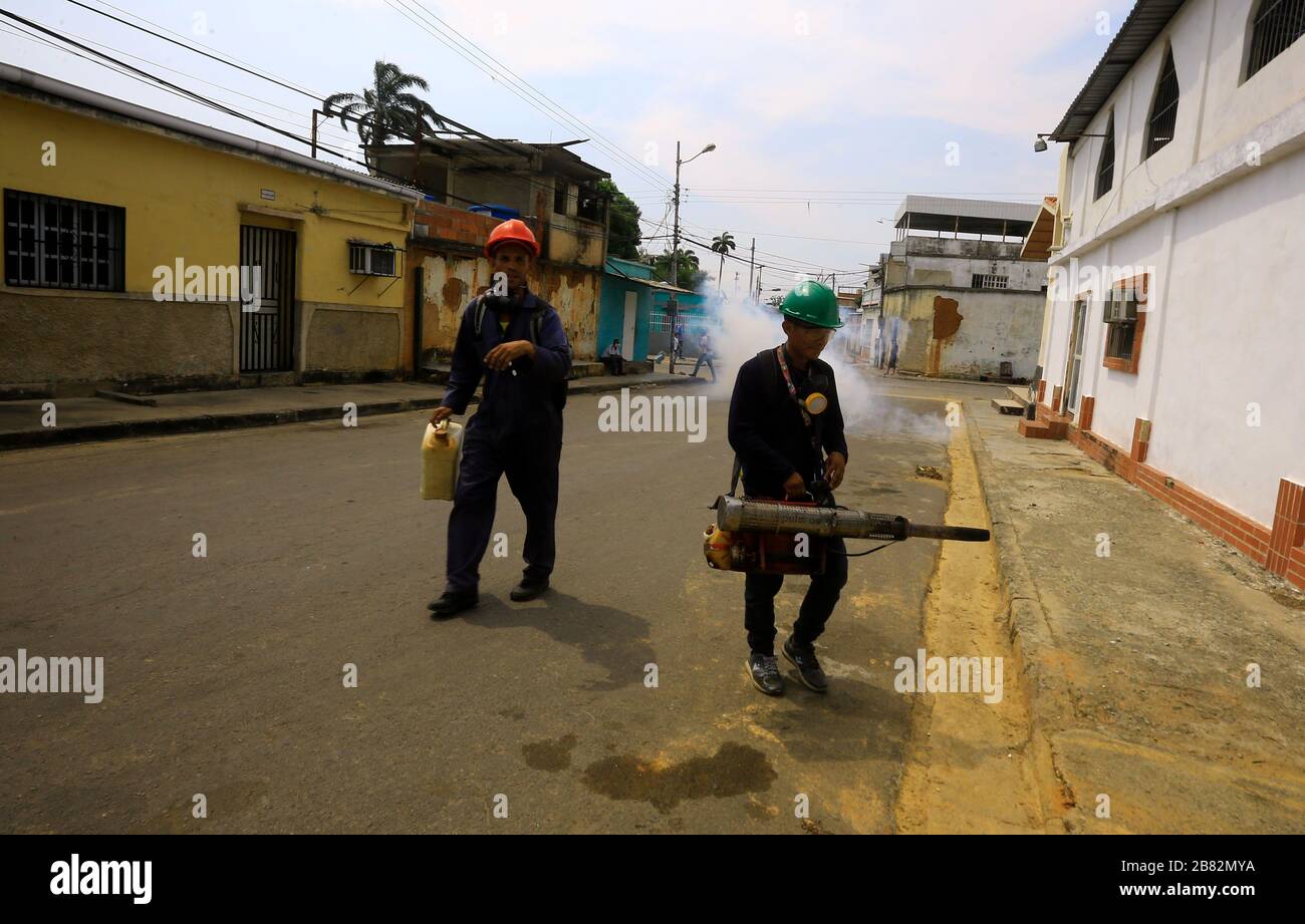 Valencia, Carabobo, Venezuela. 19th Mar, 2020. March 9, 2020, A worker performs fumigation work in residences in various sectors of the city, as a way to prevent other diseases that may arise during the Coronvirus outbreak (Covid-9). In Valencia, Carabobo state. Photo: Juan Carlos Hernandez. Credit: Juan Carlos Hernandez/ZUMA Wire/Alamy Live News Stock Photo