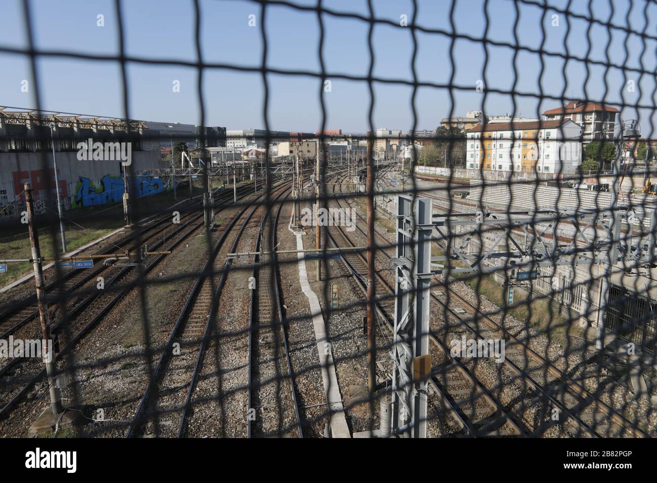 Milan, Italy. 19th Mar, 2020. General view of the Milan railway deserted due to the blockage of traffic on some railway lines on March 19, 2020 in Milan, Italy. Spring blooms in the suburbs as the Italian government continues to enforce the nationwide lockdown measures to control the spread of COVID-19. Credit: Mairo Cinquetti/Alamy Live News Stock Photo