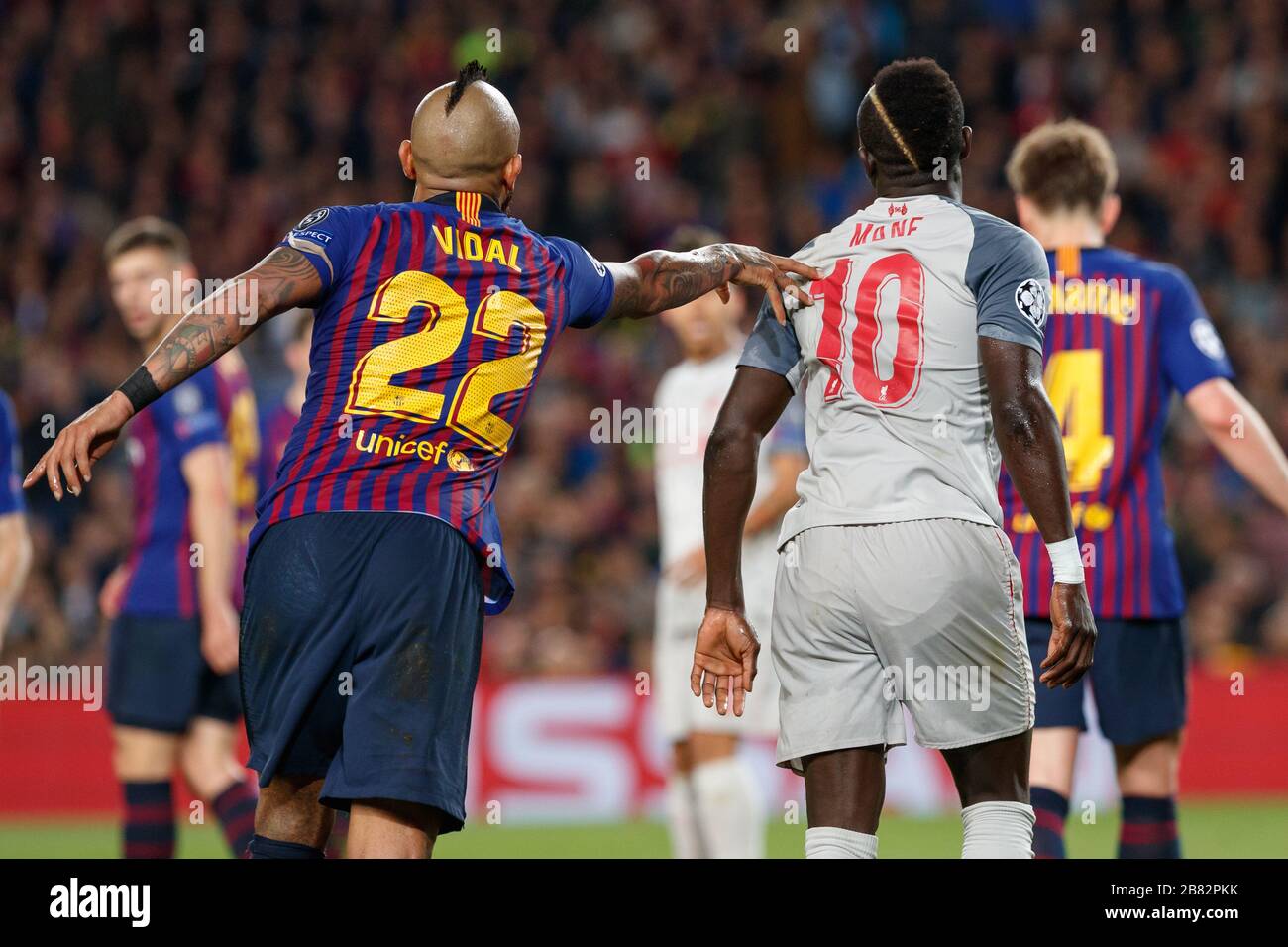 BARCELONA, SPAIN - MAY 01:  Arturo Vidal of FC Barcelona in action with Sadio Mane of Liverpool during the UEFA Champions League Semi Final first leg Stock Photo