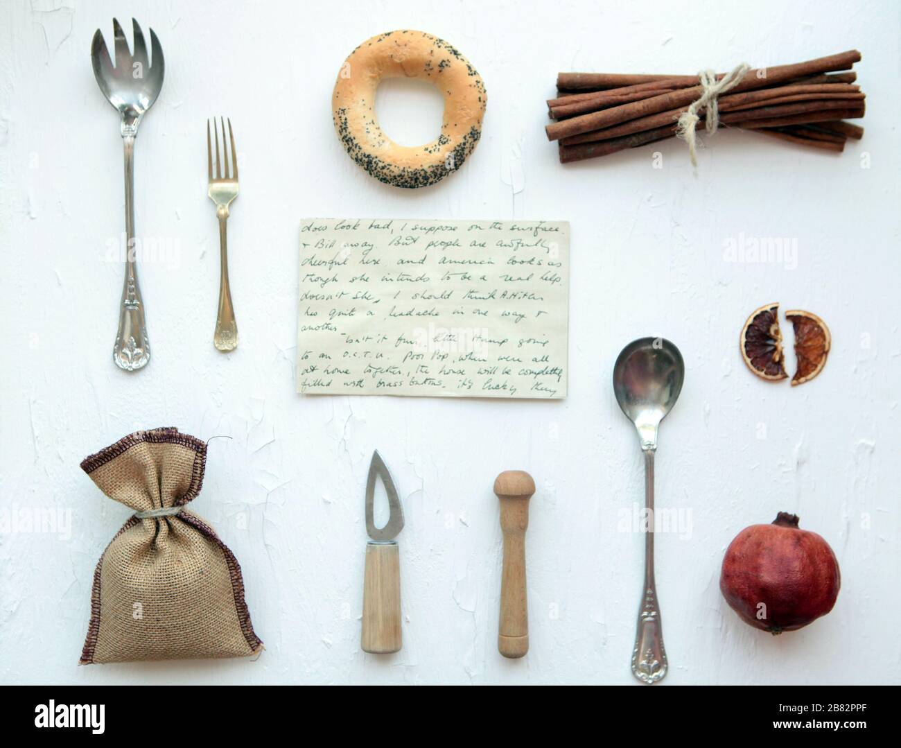 tools for food photographyknife, spoon, grapes, orange on a white