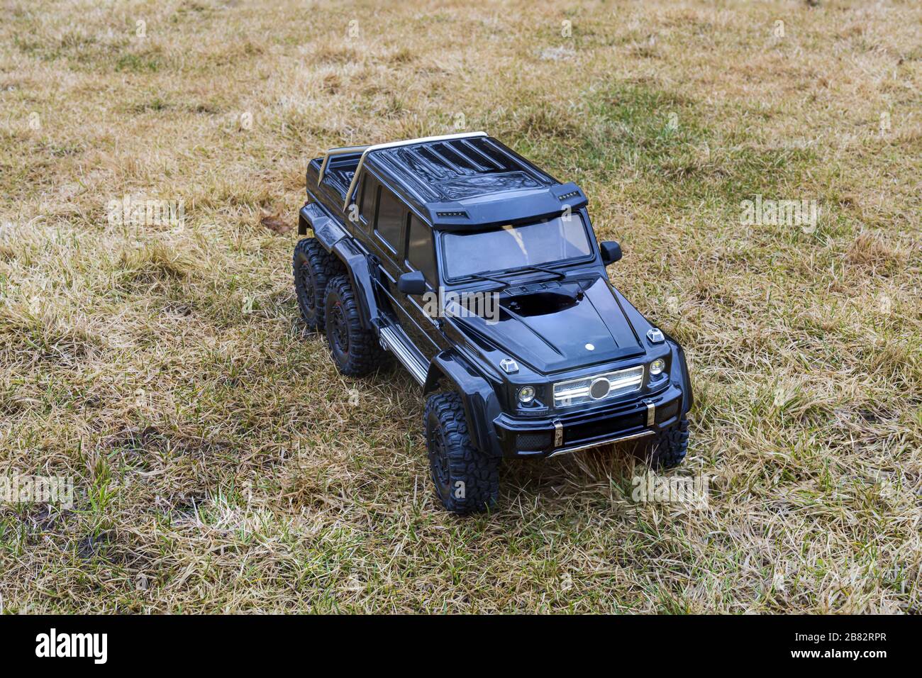 View of radio controlled model  racing car on off-road background. Toys with remote control. Free time. Children and adults concept. Stock Photo