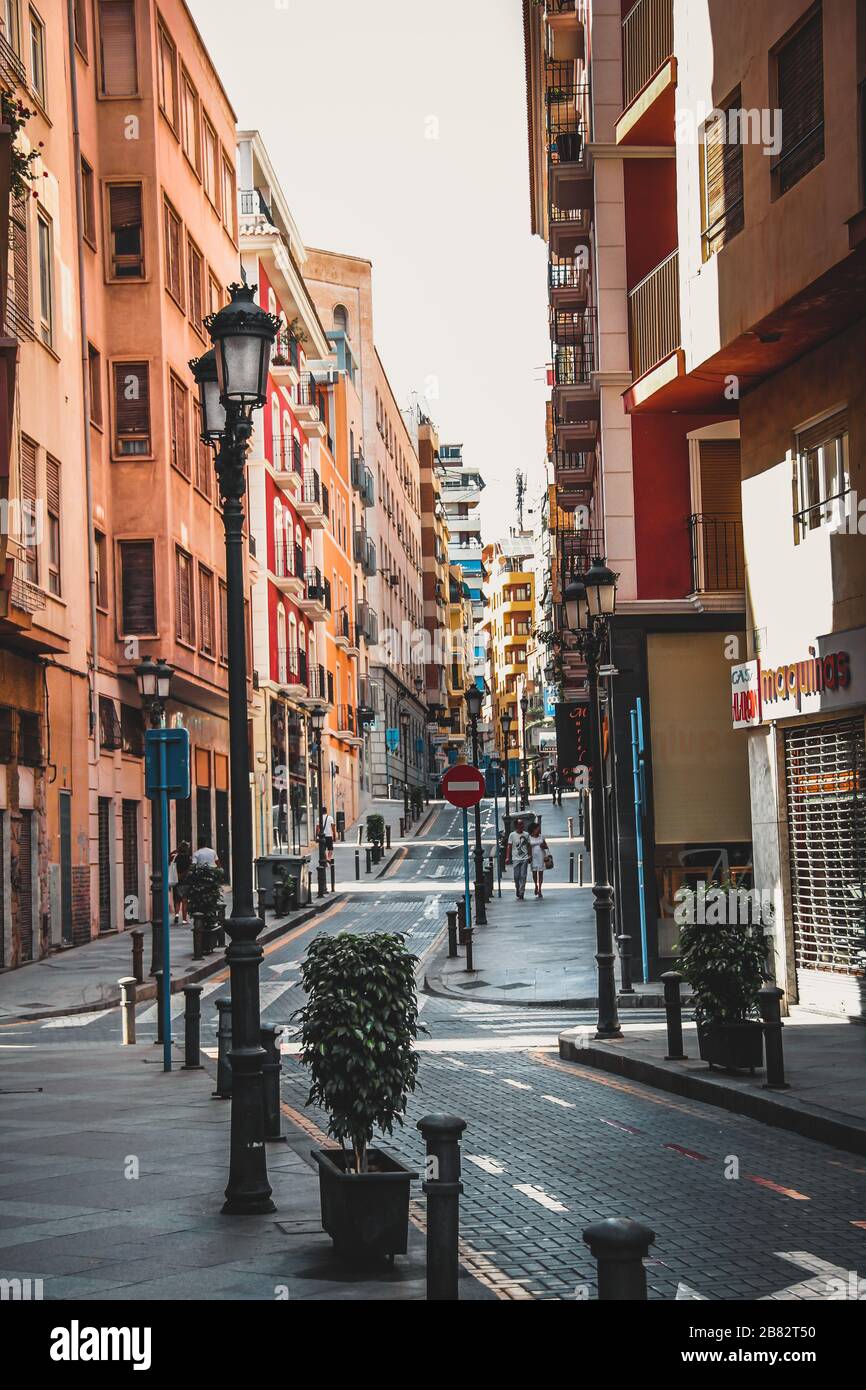 Curvy Street with Lamp Posts and Pedestrian Way Stock Photo